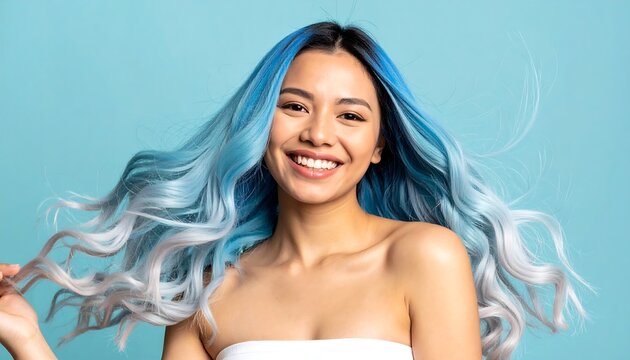 Smiling woman with vibrant blue hair