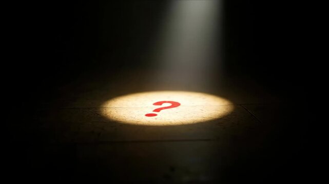 Spotlight illuminating red question mark symbol on dark floor creating dramatic lighting effect. Mystery concept for investigation services, problem solving consultations