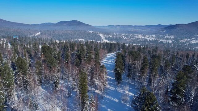 Aerial landscape Winter forest with sun, Sheregesh Kemerovo region ski resort.
