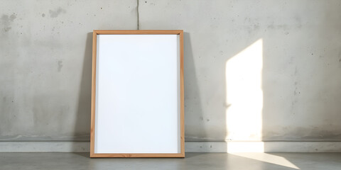 Canvas frame mockup leaning on a cement wall, soft light illuminating from right side