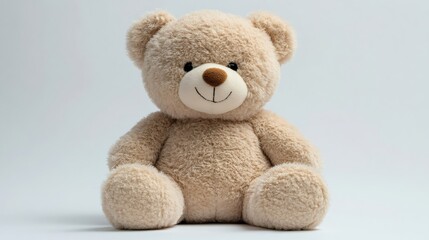 Obraz premium Smiling teddy bear sitting on white background