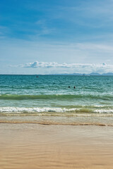 Railay Beach, Krabi Province, Thailand, 01 August 2025 : The beautiful seascape of sand beach, blue sky, sea and limestone mountains at seashore. Boats on turquoise waters. picture perfect hot day.
