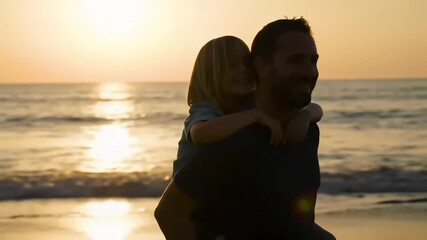 Sunset beach silhouette Man piggybacking child, ocean waves