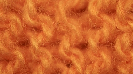 Fototapeta premium Macro shot detail image of an orange wool sweater