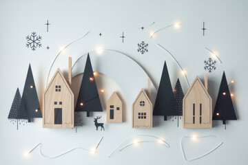 Miniature Christmas houses with pine trees winter village scene