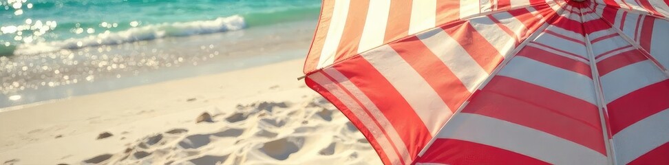 Naklejka premium Vibrant striped beach umbrella casting shade on soft sand, creating a tranquil and inviting summer scene Perfect for travel, vacation, and summer holiday themes , shadow, texture, peaceful