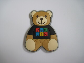 Colorful German souvenir fridge magnet from Berlin isolated on white metallic background. Template ready for your design.