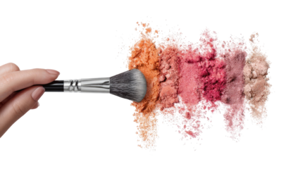 A hand holds a makeup brush above a swath of colorful loose powder