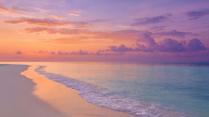 Obraz premium Serene sunset over calm ocean pink and purple sky white sand beach waves