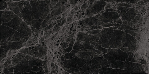 Dark and textured marble surface displaying intricate veins and natural patterns providing a sophisticated and elegant aesthetic for various design applications