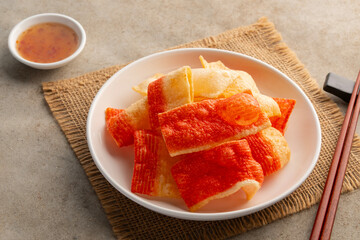 Crispy Crabstick Snack,Deep fried crab stick sheet in a plate.