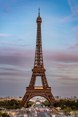 Iconic Eiffel Tower against a beautiful sunset sky, capturing the romance and magic of Parisian evenings