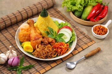 Nasi Kuning. Yellow rice is a typical Indonesian food. This food is made from rice cooked with turmeric, coconut milk and spices