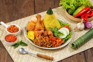 Nasi Kuning. Yellow rice is a typical Indonesian food. This food is made from rice cooked with turmeric, coconut milk and spices
