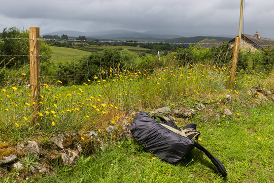 backpack with rain cover at the hiking trail on a rainy day at the Wicklow mountains