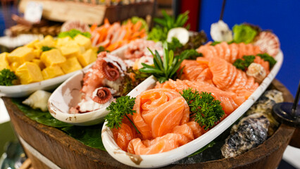Fresh sushi with shrimp and avocado salad on a seafood plate