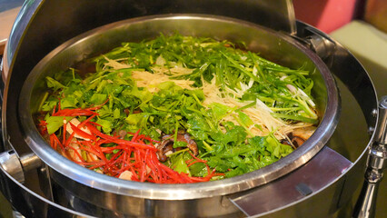 A vibrant stir fry dish with fresh vegetables, chicken, and a savory sauce is served in a bowl for a healthy dinner