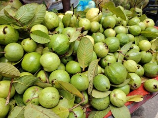 Heap of Fresh Green Guavas at the Market Vibrant Display of Tropical Fruit Ready to Eat