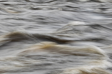 Closeup view of flowing river surface. Natur backgrounds or water texture.