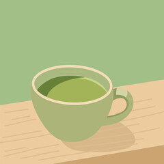 Green matcha tea on a wooden surface with a blurred view of a pastel-colored garden in the background.