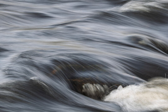 Closeup view of flowing river surface. Natur backgrounds or water texture.