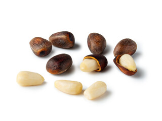 Discovering the natural beauty of pine nuts and their intricate shells on a bright surface in an artistic arrangement