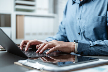 Businessperson hand using laptop. Woman freelancer typing job search. Freelance writing using...