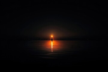 A lone candle flame, reflecting on a still lake at night