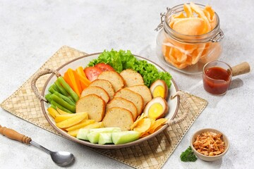Selat Galantin is known for its combination of savory, sweet, and fresh flavors from its distinctive sauce, served with chicken or beef galantin.