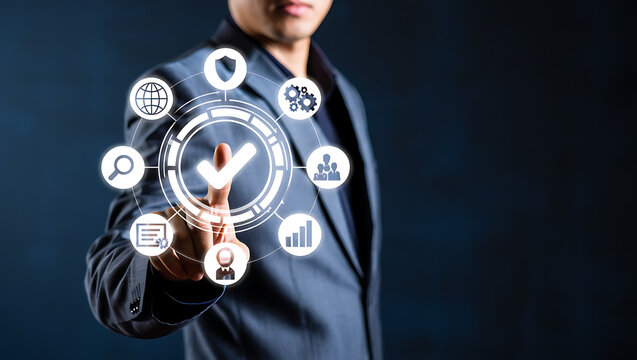 Businessman touching digital interface with checkmark and icons image