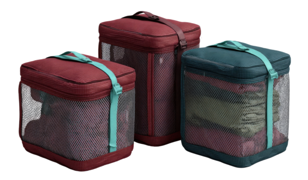 Three storage bags in varying sizes and colors, filled with clothing and gear.  Mesh panels allow visibility of contents.  Durable fabric and straps