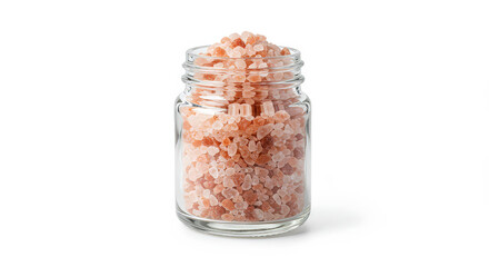 Pink himalayan salt crystals in a glass jar isolated on white background