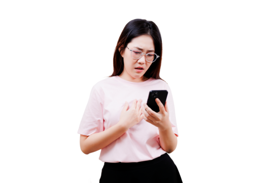 Asian young beautiful woman in a pink shirt appears concerned while looking at her smartphone.