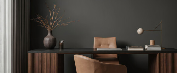 Modern home office features dark grey walls, wooden desk with black top, and brown leather chairs. Includes a minimalist lamp, vase with dried branches, books, and pen holder.