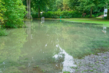 Flooded public park in Flensburg Ostseebad after heavy rainfall