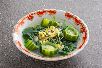 Indonesian traditional food Bening bayam gambas. spinach soup with luffa and bean sprouts