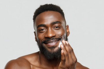 Confident Man Applying Shea Butter Beard Moisturizer on White Background