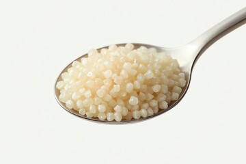 Pile of yellow or brown mustard seeds on a white background.
