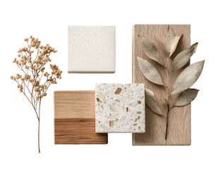 Overhead view of natural materials.  Stacked light beige and  light brown stone and wood samples, accented by a dried flower arrangement and leaf