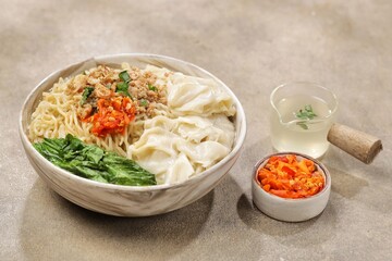 Mie Ayam Pangsit. Wonton Chicken Noodles are a type of wet noodle also known as 