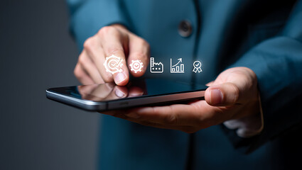 Person using smartphone with digital icons technology business