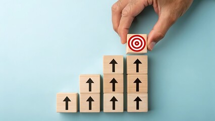 Goal achievement concept with wooden blocks arrows and target for success and growth strategy