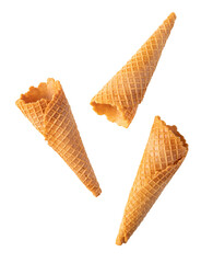 Three empty ice cream cones falling on transparent background