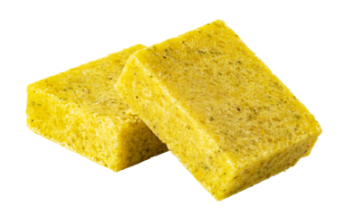 Two bouillon cubes with herbs isolated on transparent background