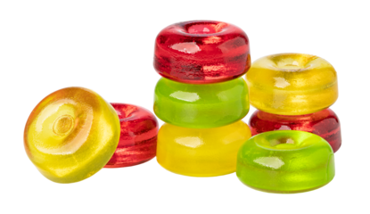 Colorful round hard candies stacked on transparent background