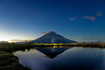 Majestic mount Taranaki at dawn with reflective lake