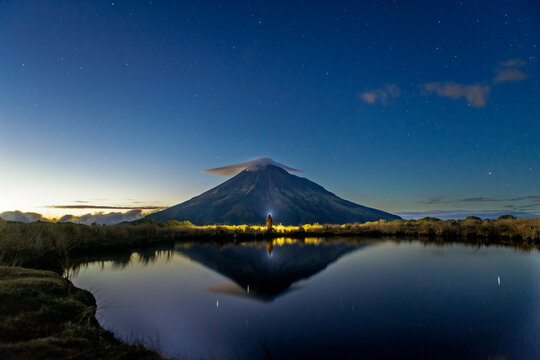 Majestic mount Taranaki at dawn with reflective lake
