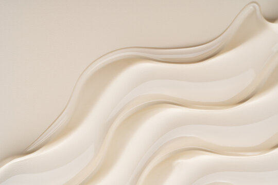 Smooth waves of beige cosmetic gel texture