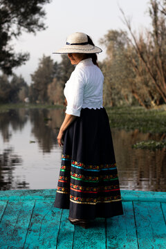 Woman in traditional attire in Xochimilco, Mexico