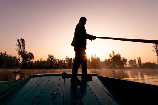 Silhouette of Trajinera Boatman at Sunrise in Xochimilco, Mexico